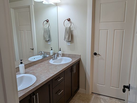 Shared bath, accessible from both bedrooms.