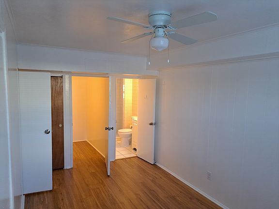 Bedroom area toward bath and storage