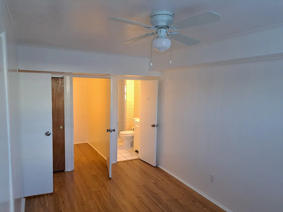 Bedroom area toward bath and storage