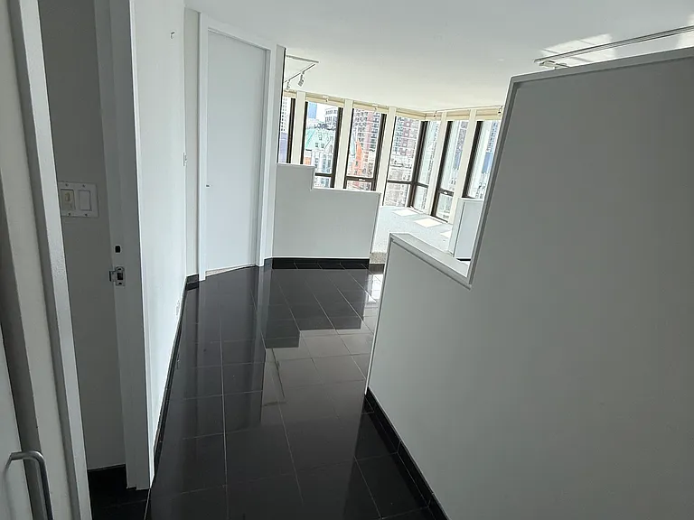 Foyer and looking into apartment.