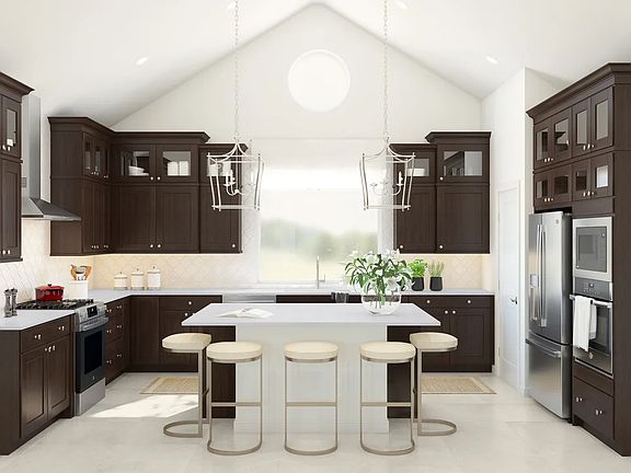 Kitchen with vaulted condition and pendant lighting