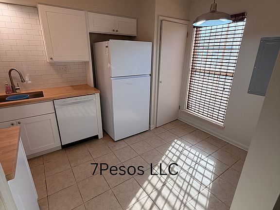 Remodeled kitchen with laundry closet.
