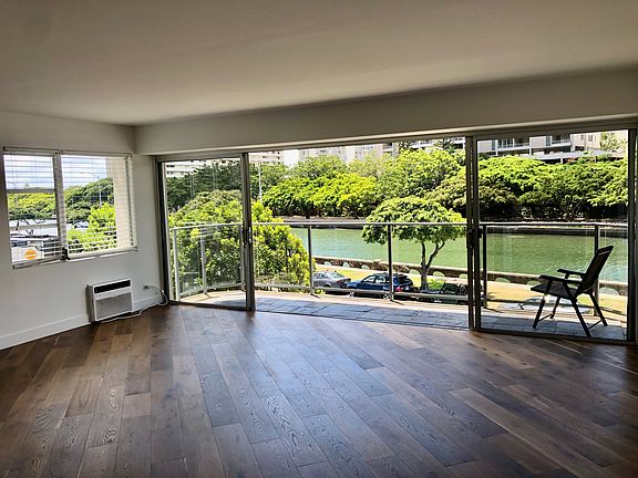 20 by 17 living room with beautiful hardwood floors.
