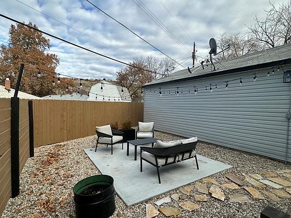 patio furniture/bistro lights/ garden flower boxes included