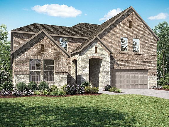 A two-story brick house with a gabled roof, surrounded by a well-manicured lawn and lush greenery, s