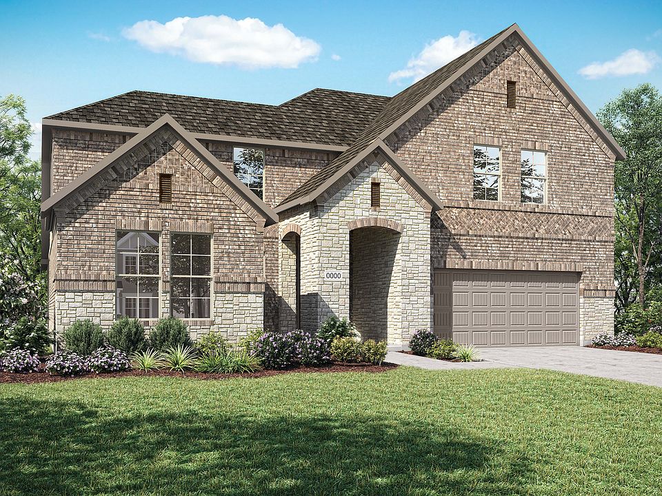 A two-story brick house with a gabled roof, surrounded by a well-manicured lawn and lush greenery, s