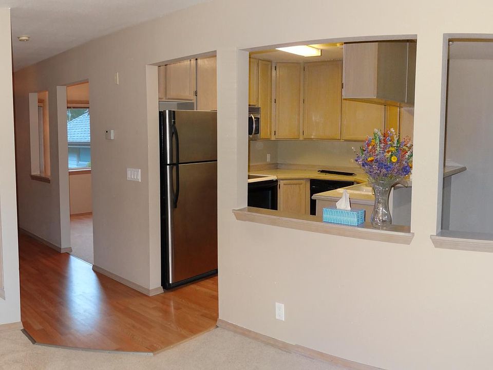 Open space design. On the left side from the kitchen is an office room, on the right side from the kitchen is a dining room.