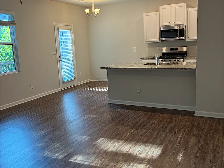 Living space view to kitchen and dinette area