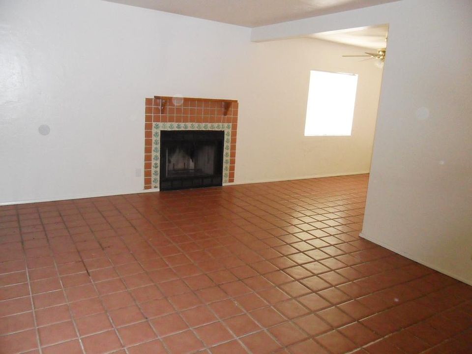 Tile living room with decorative fire place