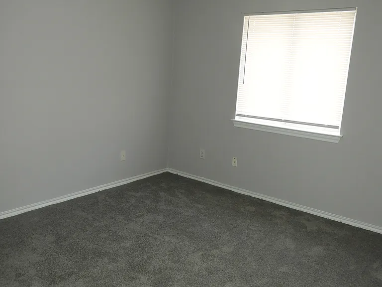 Bedroom #2 with ceiling fan and walk-in closet.