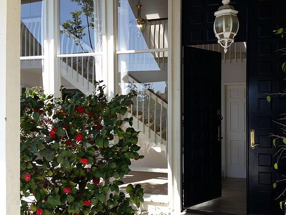 Elegant entry and tall front doors.