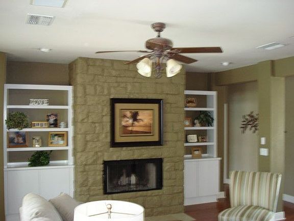 Custom bookshelves around fireplace
