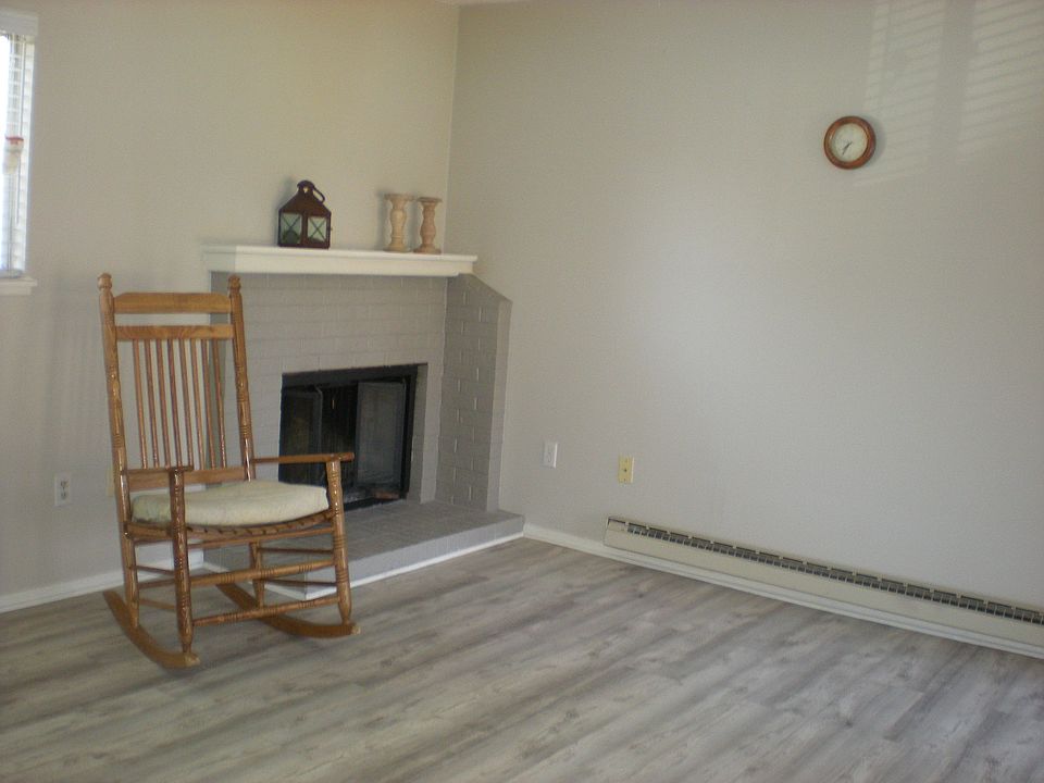 Rockin' by the fireplace with nice mantle.