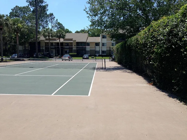 Screened tennis court