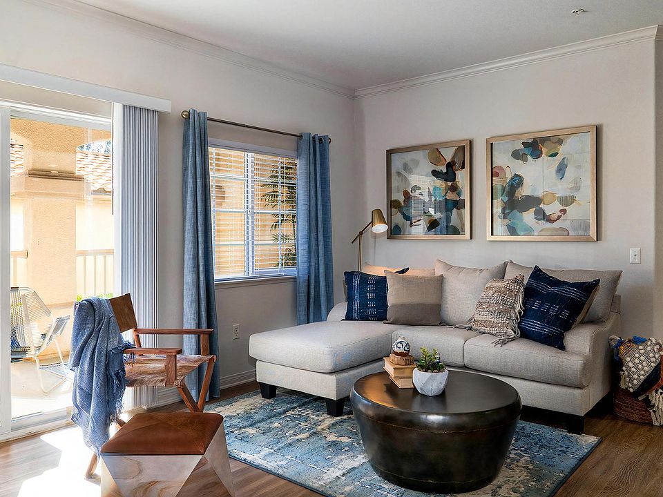 Modern Living Room With Patio Access and Layered Textiles