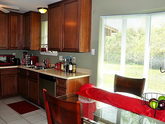 next to breakfast area 10x9 with bay windows which is double pane and 2" faux blinds