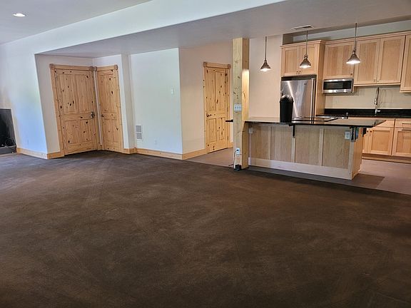 Kitchen area with adjoining large pantry/storage. Large front closet on the left.