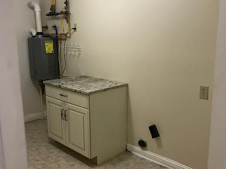 Large Custom cabinet with granite top in your laundry