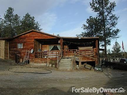 Main House
						:
						South end Covered Carport on back side of house.
2 car garage on other end .