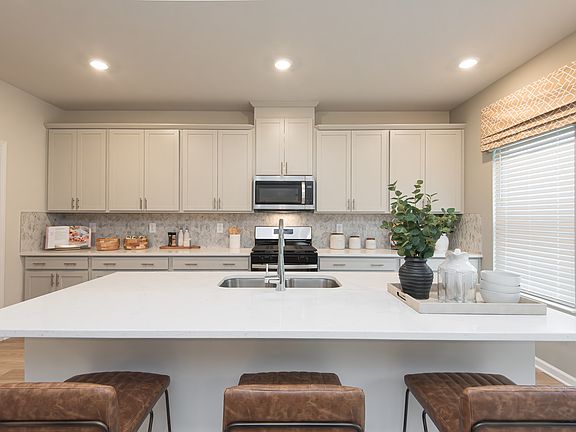 The Dakota floorplan with the Divine Gray interior package modeled at Ivey Township.