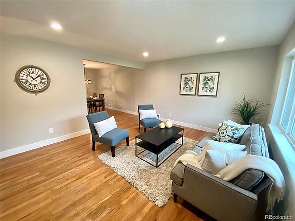 Living room with hardwood floors and natural light