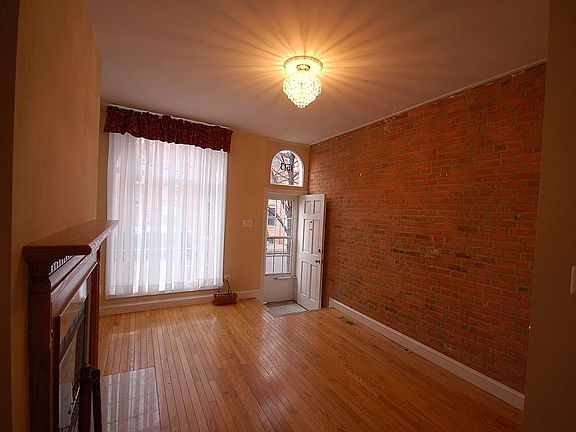Fireplace, hardwood, exposed brick, picture window, more photos...coming soon.