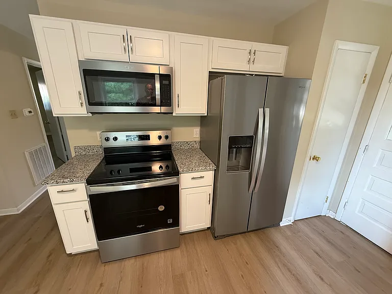 Kitchen offers all new appliances and multiple walls of new cabinets plus a pantry
