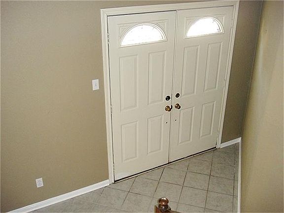 From the stairs looking at the front door.