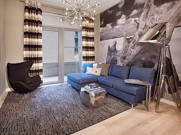 Living area with hard surface flooring and balcony