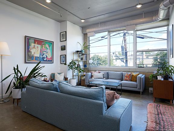 Large living room with space for two sofas. Ready to be lounge space of your dreams!