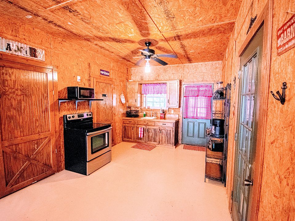 Cute kitchen which has stove, fridge, microwave, coffeemaker, mixer, blender, electric tea pot, and so much more. The only thing it doesn't have is a dishwasher.