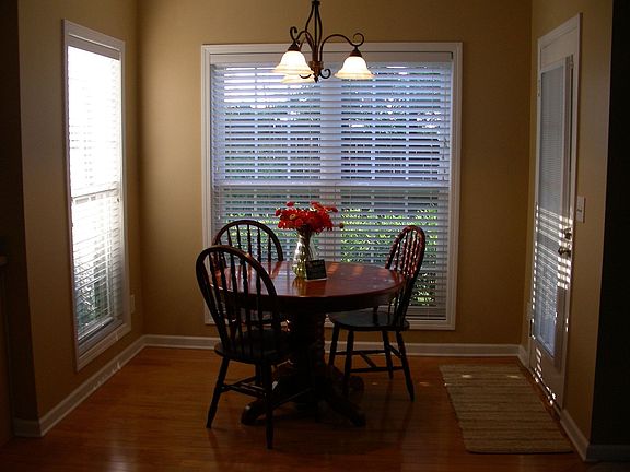 BREAKFAST ROOM WITH CEILING TO FLOOR WINDOWS ON THREE SIDES
