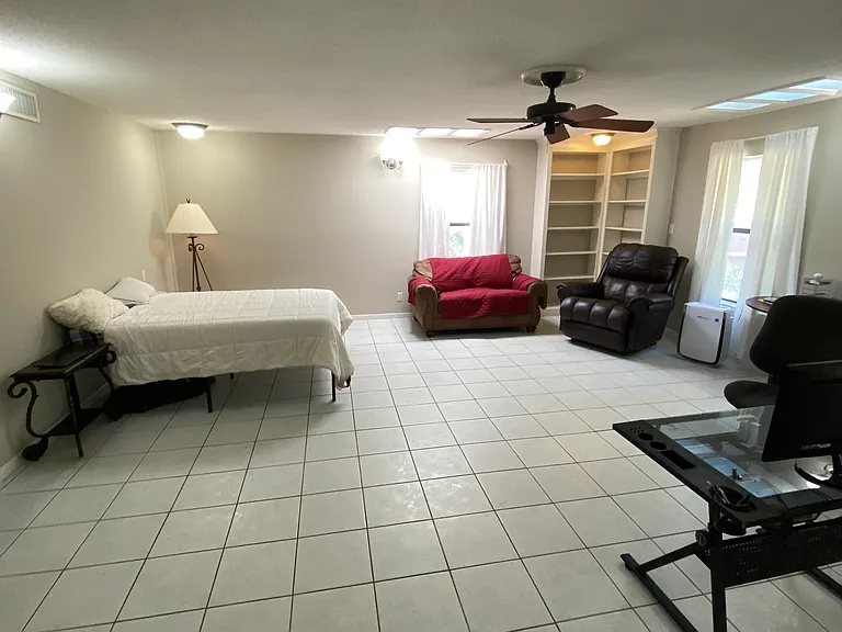 This is the den. We used it as a bedroom. It has french doors leading to the sunroom.