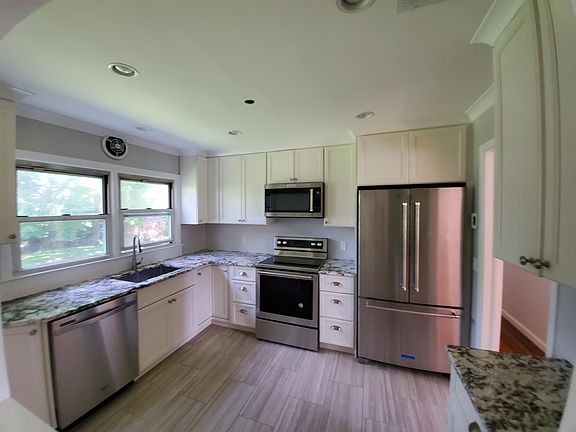 Newly remodeled kitchen with Kitchen Aid appliances and Heated Floor