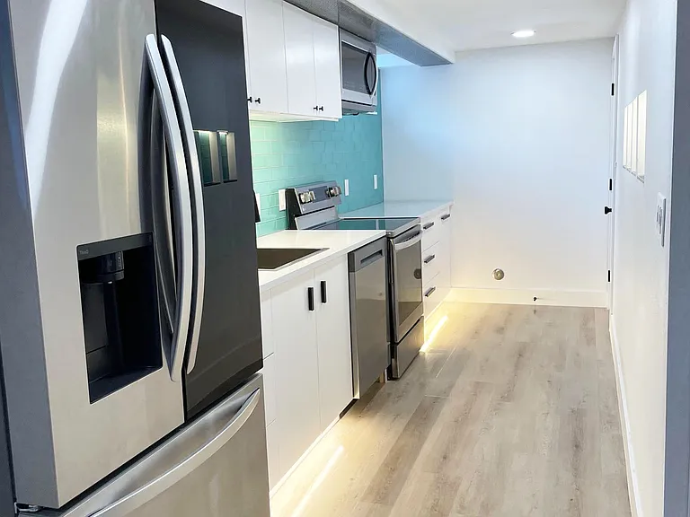 Brand new kitchen with under cabinet LED lighting