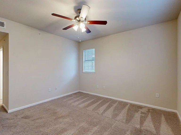 Spacious apartment Bedroom with Carpet Floor.