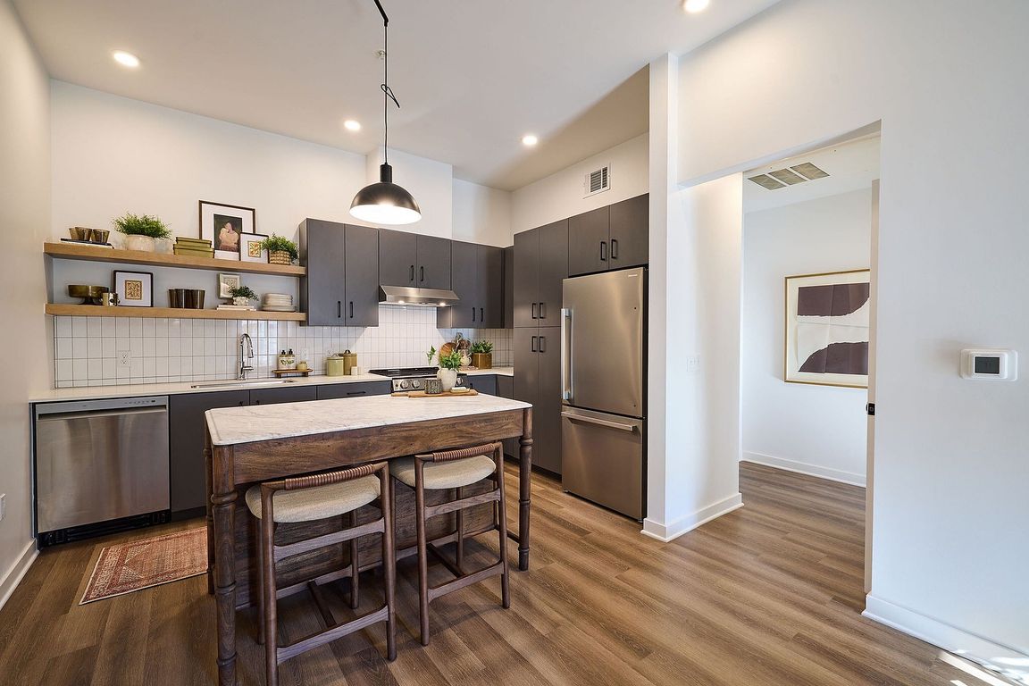 Modern kitchen with sleek dark cabinetry