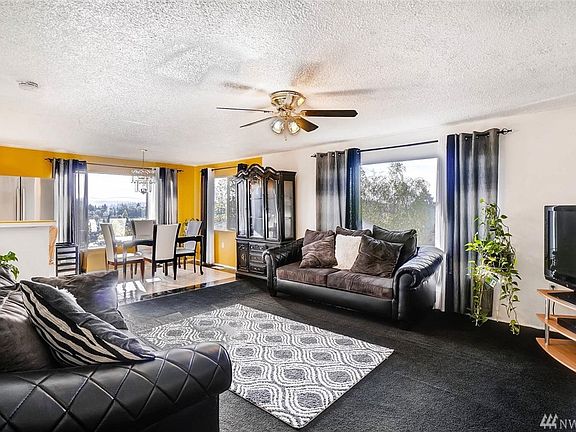 Living room opens to Dining with large windows to take advantage of the views.