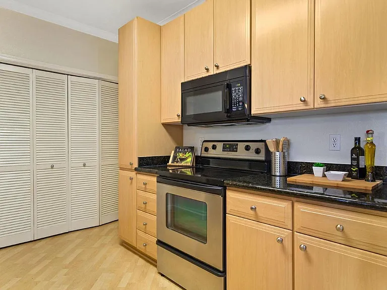 Full size washer and dryer behind closet doors