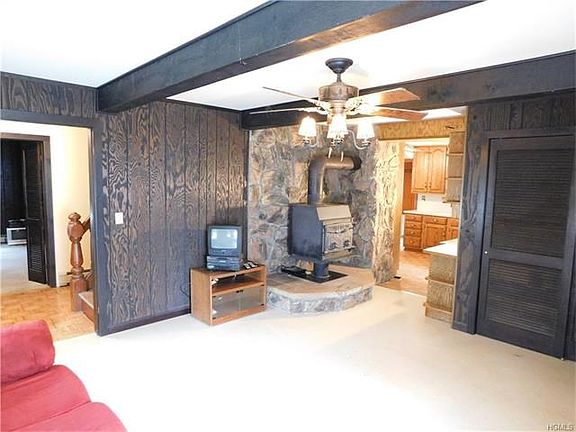 Cozy living room with wood burning stove.