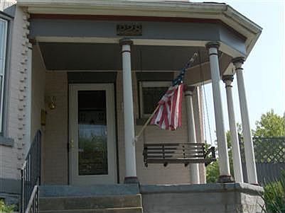 Swing the lazy days away on front porch