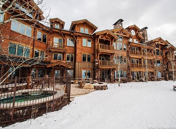 Grand Lodge slope side patio with fire pit and hot tub