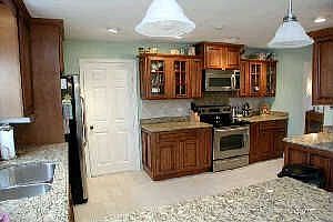 Gorgous new kitchen cabinets with granite countertops and ceramic backsplash!