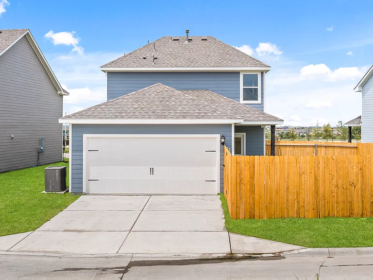 The Dogwood plan has an ally-load, two-car garage.