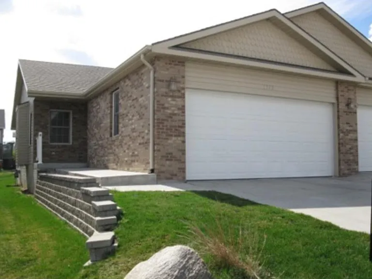 Secure and private entry with automatic garage door opener and key pad.