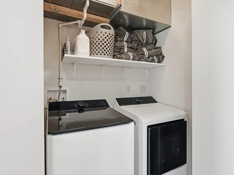 Laundry room on main level w/ W & D and extra bedding & pillows.