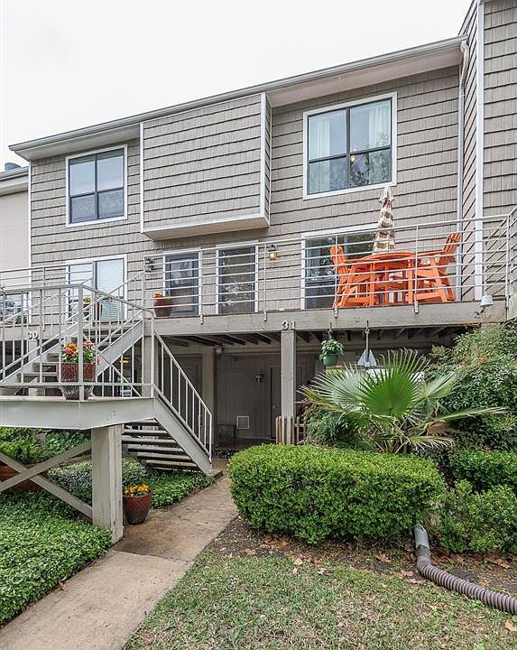 Welcome home to 31 Lakewood Lane in the exclusive Lakewood Yacht Club. Your front door is lit at the right. You have extra storage (or small workshop) across from the base of the stairs and an adjacent covered seating area below the front porch, behi