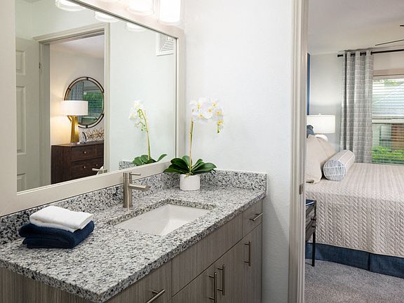 Wood grain cabinets and framed mirrors