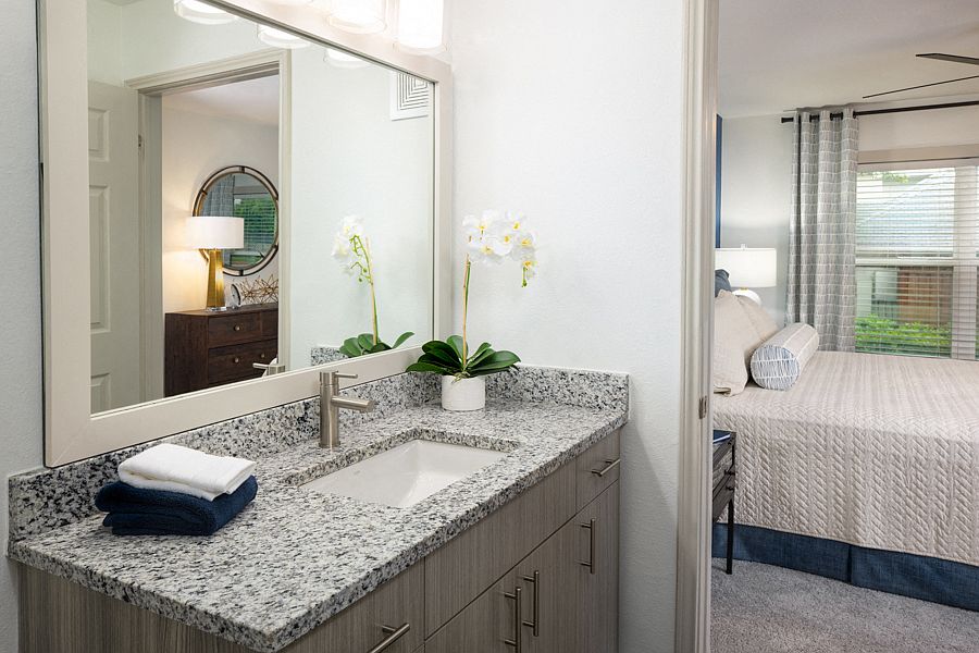 Wood grain cabinets and framed mirrors