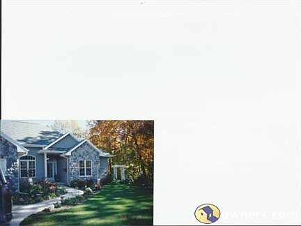 Stone Trimmed Lakefront Ranch Home